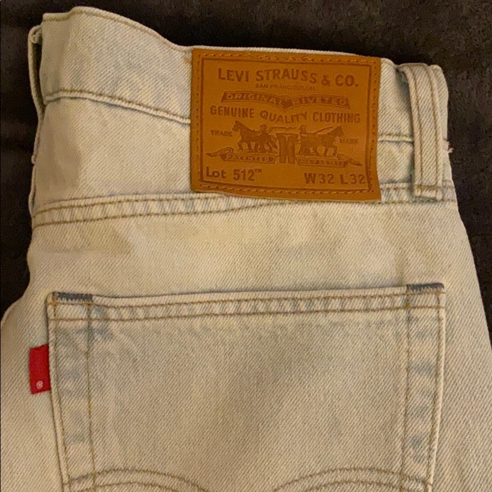 White Levi’s pants with night light stripes.